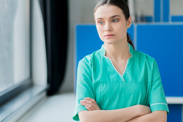 Female nurse with arms crossed