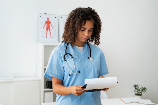 Free photo female nurse working at the clinic