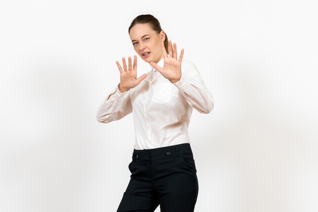 female office employee in elegant white blouse on white