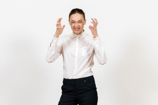 female office employee posing in white blouse on white