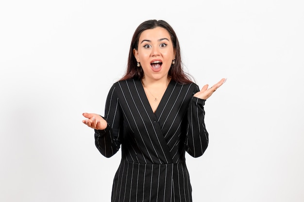 female office employee in strict black suit on white