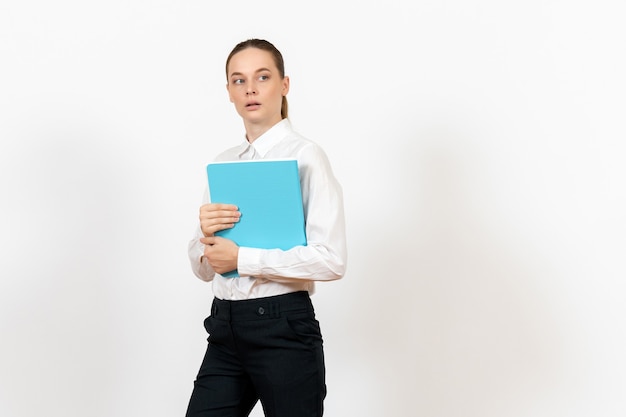 female office employee in white blouse holding blue file on white