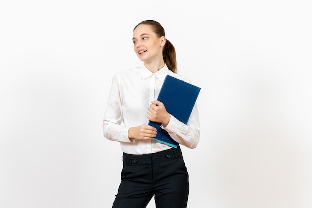female office employee in white blouse holding documents on white