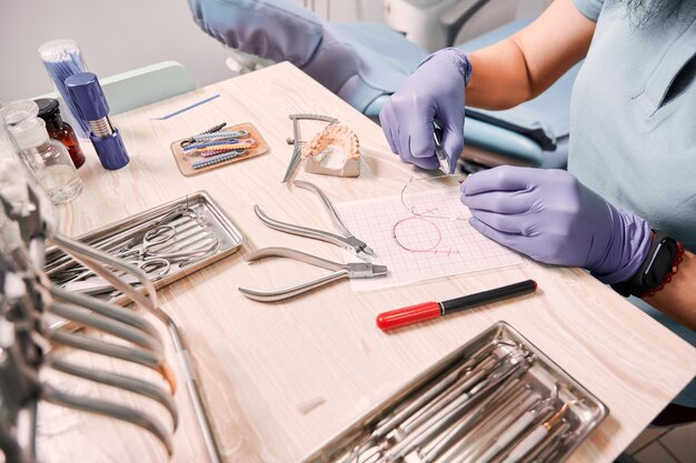 Female orthodontist working in dental office