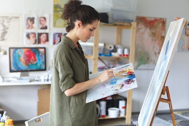 Female painter in her art studio