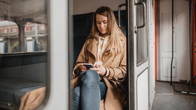 Female passenger sitting in a train alone