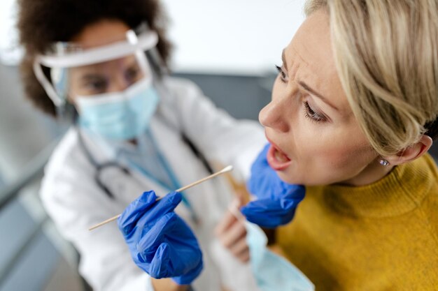 Female patient during coronavirus PCR testing at the hospital