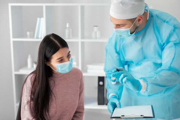 Free photo female patient getting vaccinated for coronavirus