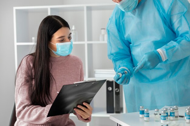 Female patient getting vaccinated for coronavirus