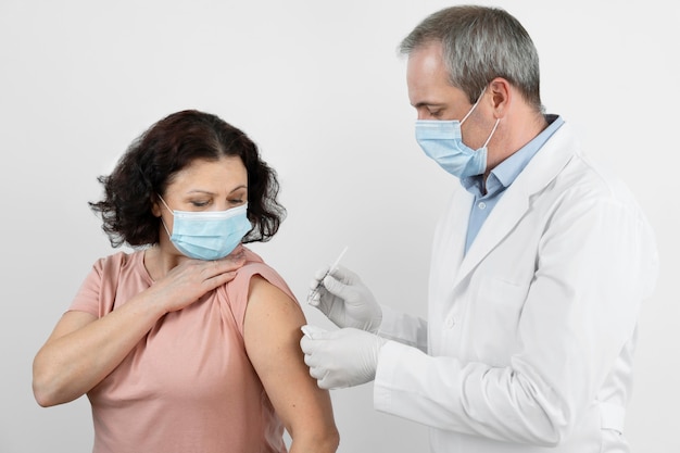 Female patient getting a vaccine