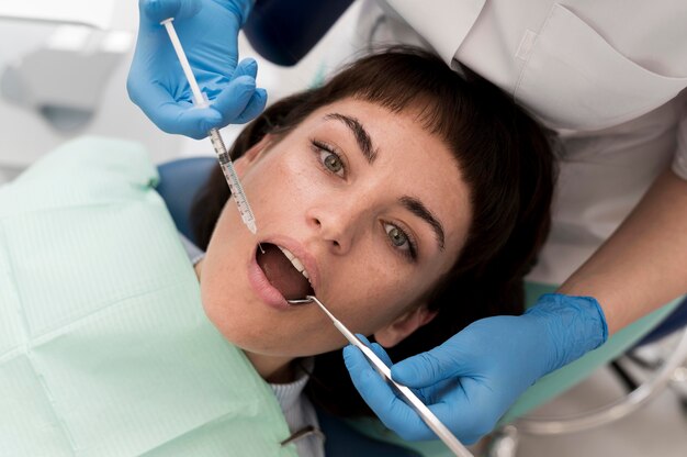 Female patient having a procedure done at the dentist