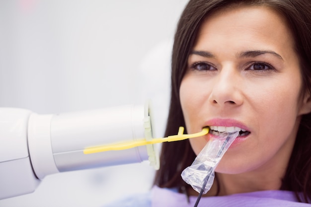 Female patient receiving dental treatment