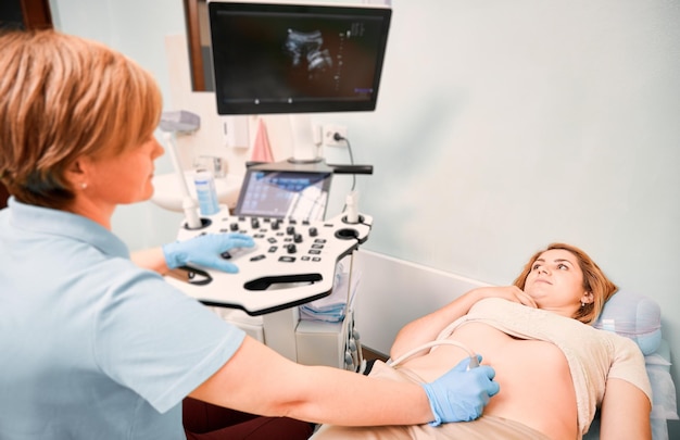 Female patient undergoing ultrasound procedure in medical center