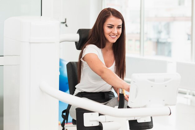 Female patient using medical machine