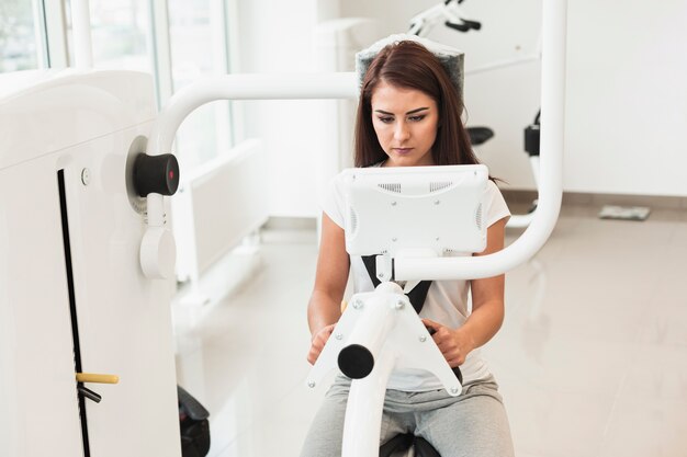 Female patient using medical machine