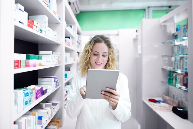 Female pharmacist working in drug store