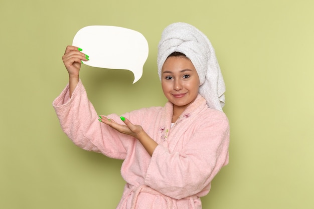 Free photo female in pink bathrobe with smile on her face