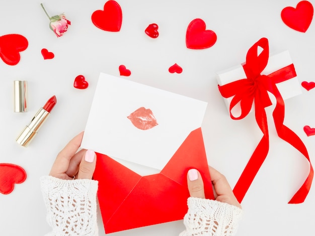 Female preparing letter with lipstick mark