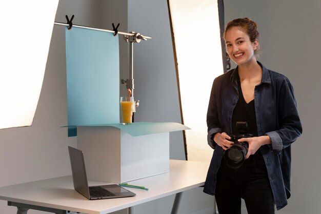 Female product photographer in studio