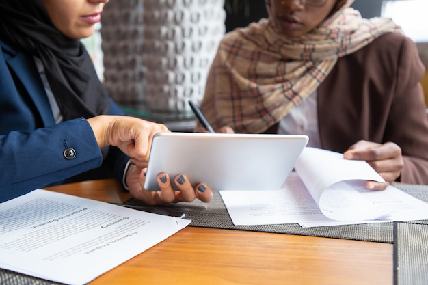 Free photo female professionals working on documents