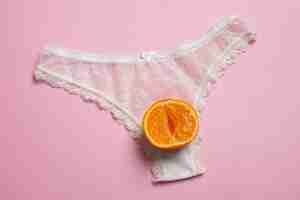 Free photo female reproductive system concept with orange top view