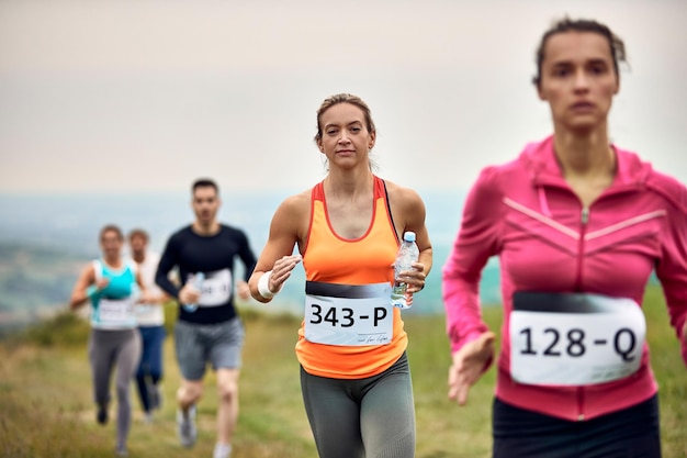 Female runner participating in a marathon in nature