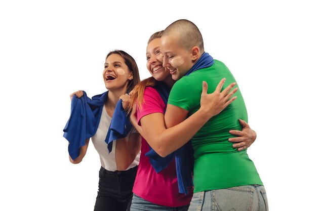 Female soccer fans cheering for favourite sport team with bright emotions isolated on white