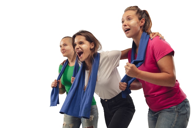 Female soccer fans cheering for favourite sport team with bright emotions isolated on white