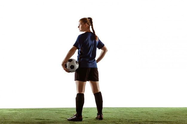 Female soccer, football player kicking ball, training in action and motion isolated on white background