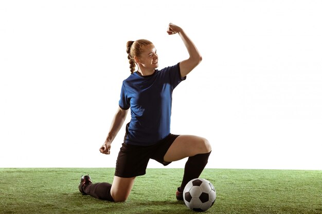 Female soccer, football player kicking ball, training in action and motion isolated on white background