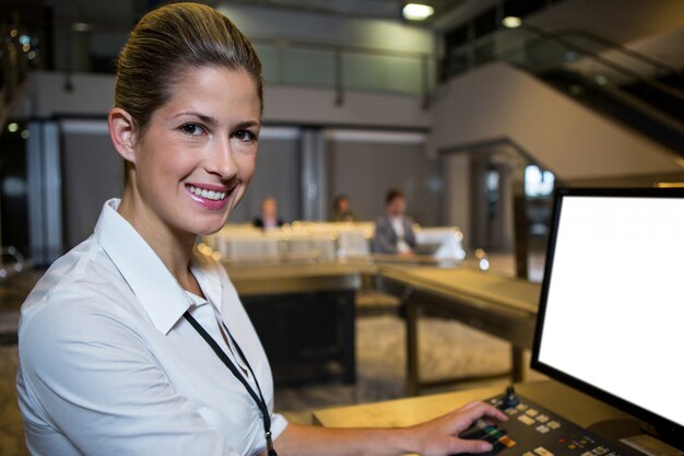 Female staff working in airport terminal