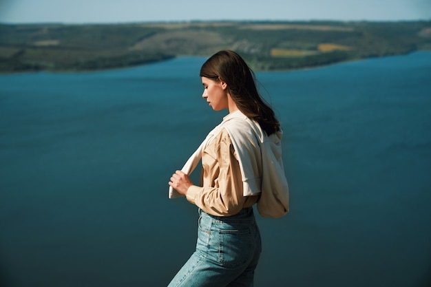 Female standing on top of mountain near dniester river