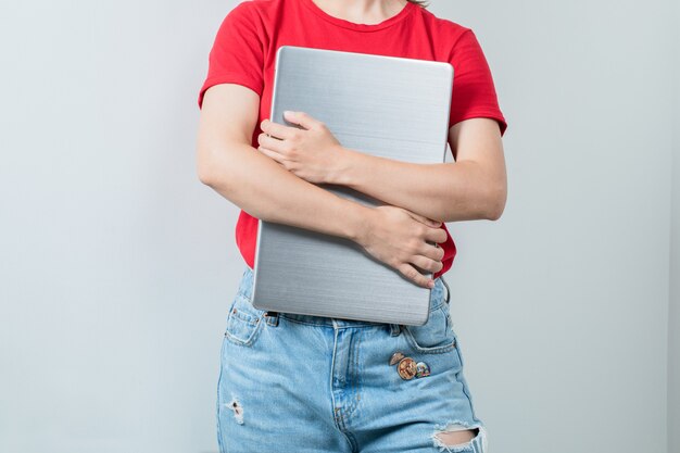 Female student holding a blank project sheet