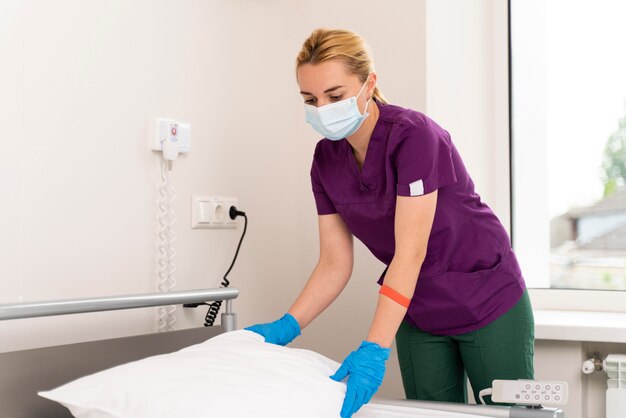 Female student at medicine wearing medical mask while doing her practice