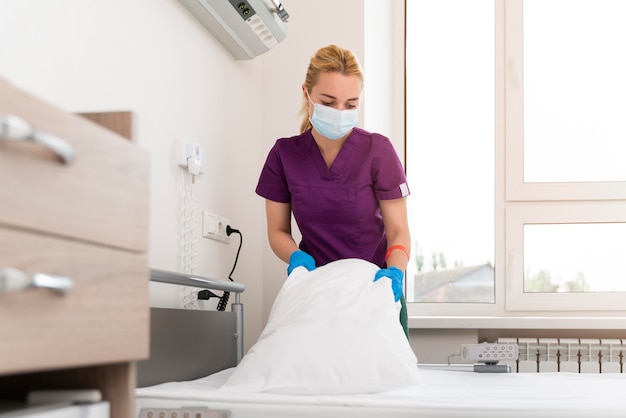 Female student at medicine wearing medical mask while doing her practice