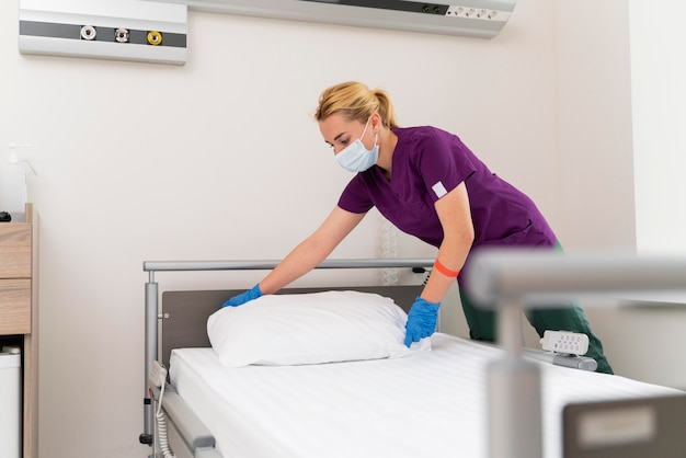 Female student at medicine wearing medical mask while doing her practice