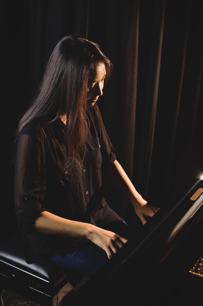 Female student playing piano