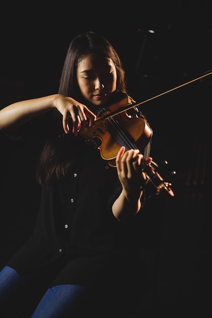 Female student playing violin