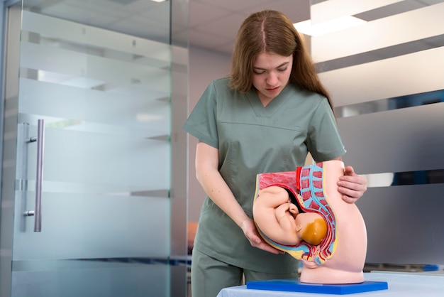 Female student practicing medicine