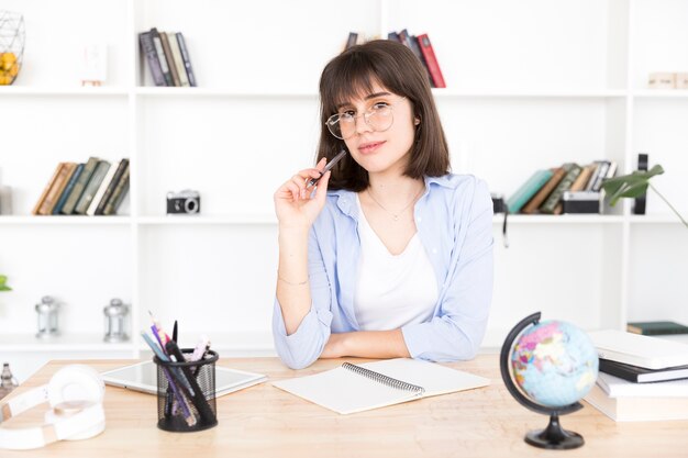 Female student thinking at task