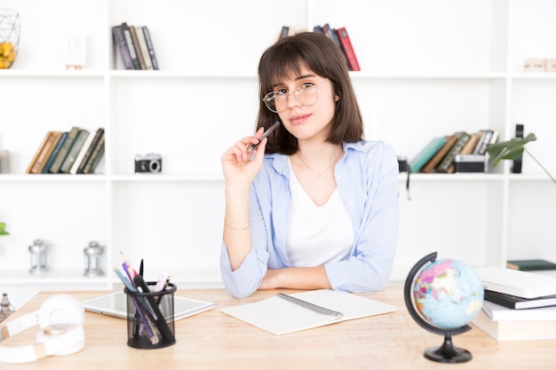 Female student thinking at task