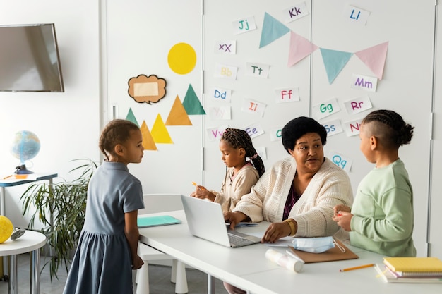 Female teacher talking with students