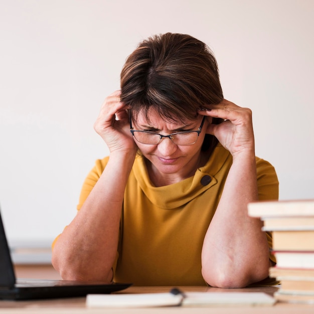 Female teacher with laptop close-up