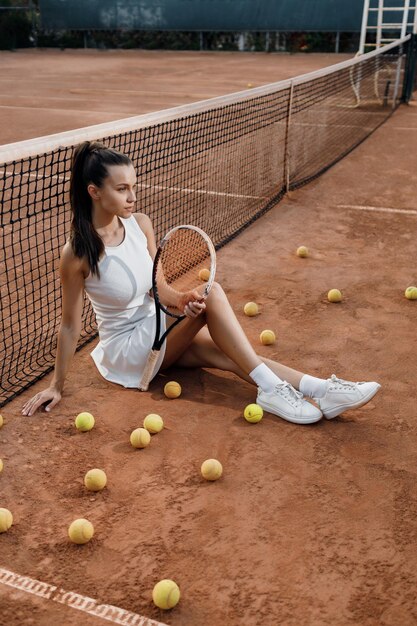 female tennis player with rocket