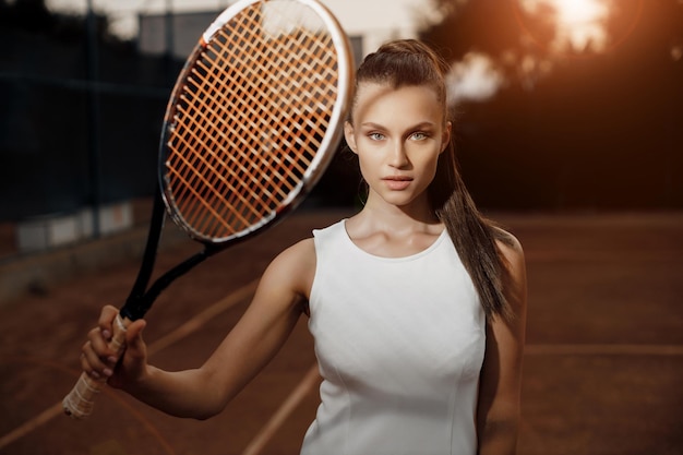 female tennis player with rocket