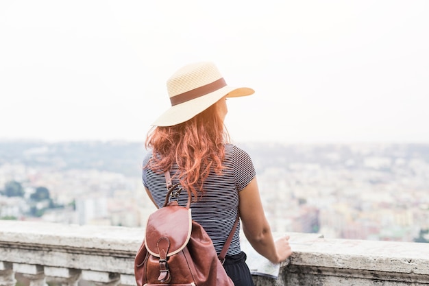 Female tourist looking at city