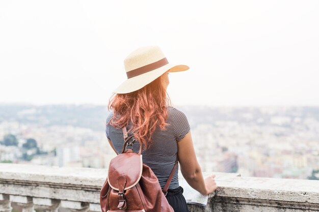 Female tourist looking at city