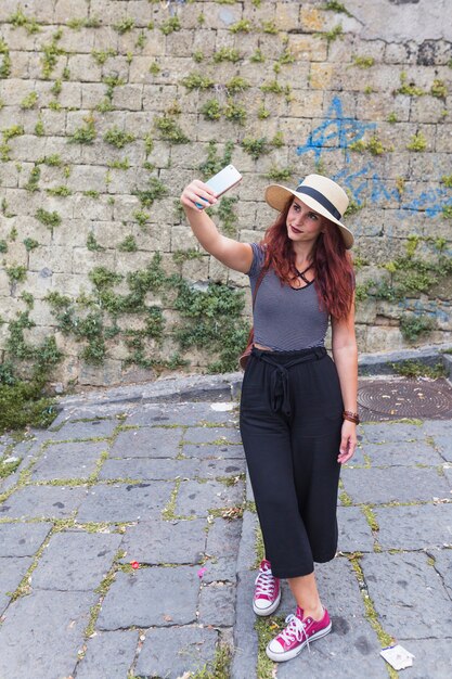 Female tourist taking selfie