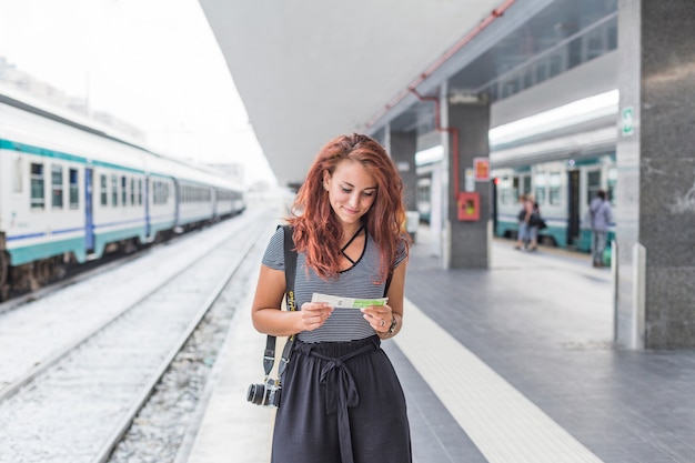 Female tourist waiting for train