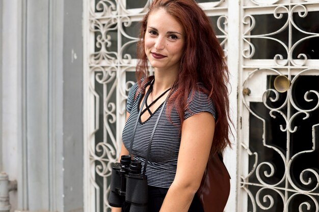 Female tourist with binoculars